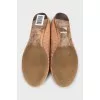 Pink leather ballet flats with signature weave