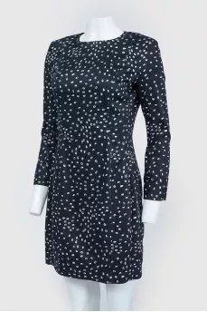Black dress with white polka dots with a zipper