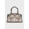 A bag with a signature print and patch pockets