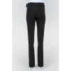 Black pants highlanding with a tag