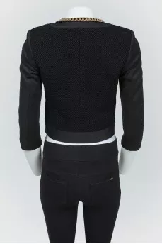 Black jacket with golden chains with a zipper