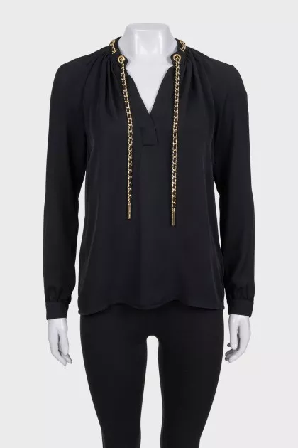 Black loose-fitting blouse with decoration