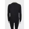 Black loose-fitting blouse with decoration