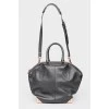 Black leather zip bag with tag