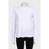 White straight-cut jumper with a tag