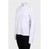 White straight-cut jumper with a tag