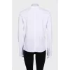White straight-cut jumper with a tag