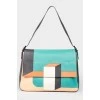 Leather bag with multi -colored abstract print