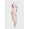 Fitted dress decorated with gold buttons