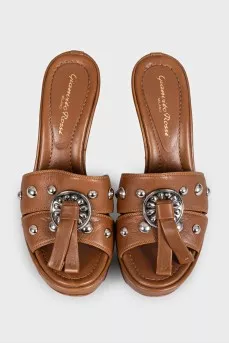 Brown leather sandals with metallic embellishments