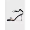 Black sandals decorated with bows