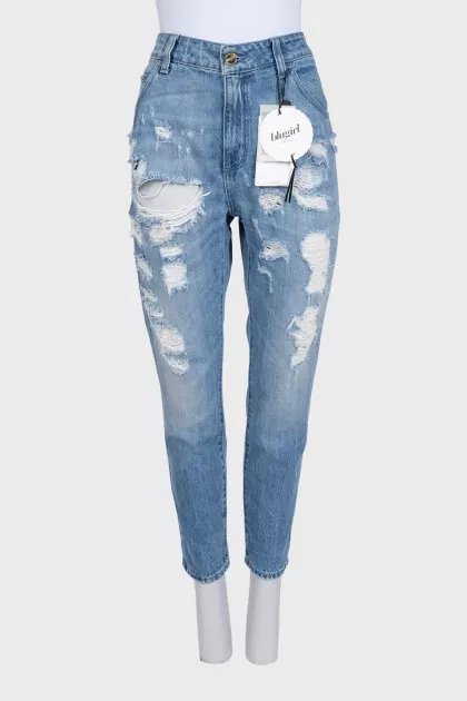 Blue ripped jeans with tag