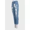 Blue ripped jeans with tag
