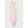 Beige cropped trousers with tag