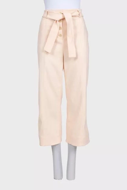Beige cropped trousers with tag