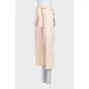 Beige cropped trousers with tag