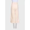 Beige cropped trousers with tag