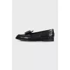 Leather loafers decorated with bows
