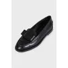 Leather loafers decorated with bows