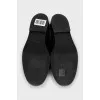 Leather loafers decorated with bows
