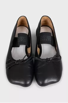 Black leather ballet flats with elastic band