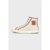 Beige sneakers with a signature print