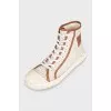 Beige sneakers with a signature print