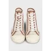 Beige sneakers with a signature print