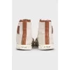 Beige sneakers with a signature print