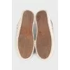 Beige sneakers with a signature print