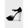 Black sandals with decorated heels