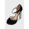 Black sandals with decorated heels