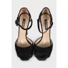 Black sandals with decorated heels