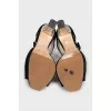 Black sandals with decorated heels