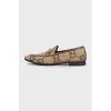 Brown loafers with a signature print