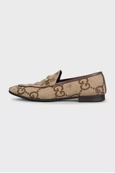 Brown loafers with a signature print