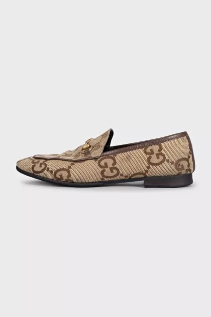 Brown loafers with a signature print