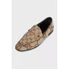 Brown loafers with a signature print