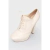 Beige leather high -heeled boots