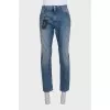 Men's blue distressed jeans with a zipper