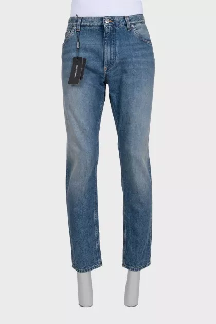 Men's blue distressed jeans with a zipper
