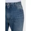 Men's blue distressed jeans with a zipper