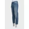 Men's blue distressed jeans with a zipper