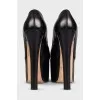 Leather shoes with a high platform and heels