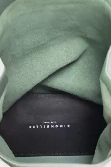 Green leather clutch with signature print