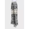 Beige straight-leg trousers with a print