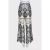 Beige straight-leg trousers with a print