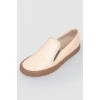 Leather moccasins with brown soles