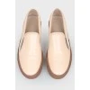 Leather moccasins with brown soles
