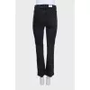 Black skinny fit button-down jeans